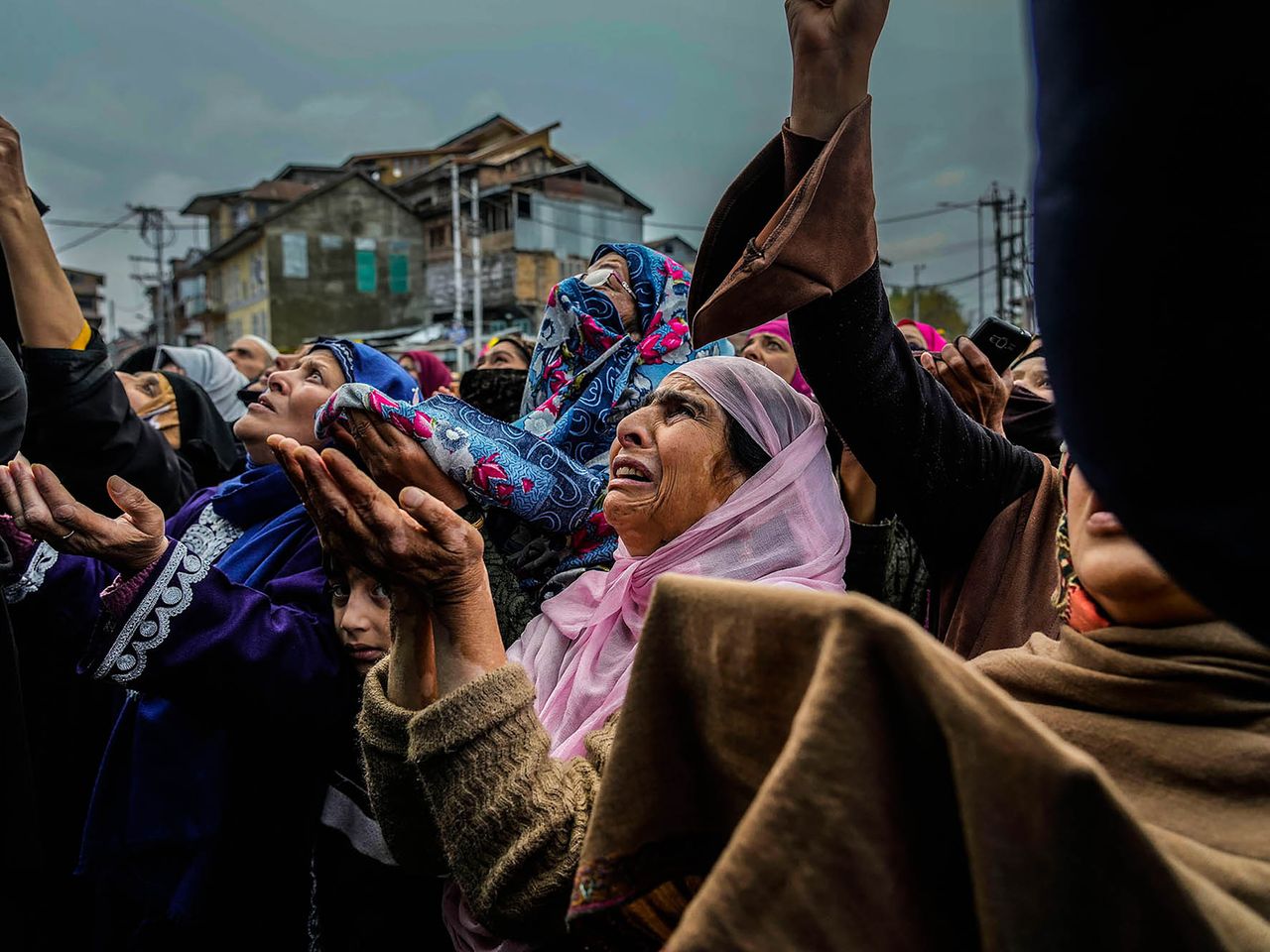 Kashmiri Muslim women devotees weep while praying as a priest displays a relic of Sufi saint Sheikh Syed Abdul Qadir Jeelani outside his shrine in Srinagar, Indian controlled Kashmir, Monday, Nov. 7, 2022. Hundreds of devotees have gathered at the shrine for the 11-day festival that marks the death anniversary of the Sufi saint. This project documents ongoing unrest in the long-disputed region of Kashmir, dating back to 1947, when India and Pakistan gained independence from Britain. Both nations claim Kashmir in its entirety, and each administers a portion of the region. In Indian-administered Kashmir, rebels have been fighting Indian rule for decades, seeking to unite the territory, either under Pakistani rule or as an independent country. India says that Pakistan supports armed insurgency in Kashmir. Pakistan denies the charge, saying it provides moral and diplomatic support only.